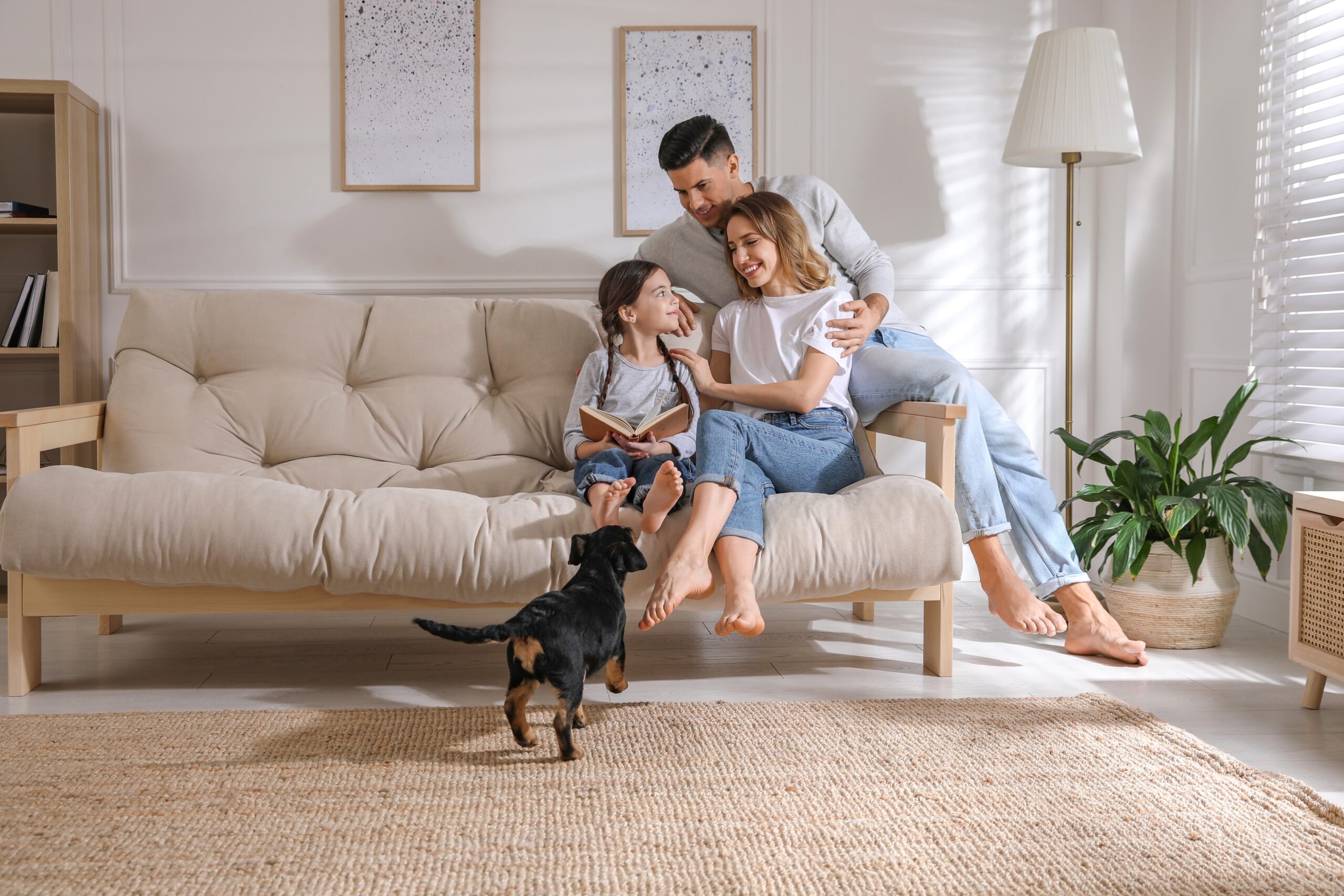 Happy family relaxing in a bright living room with efficient climate control