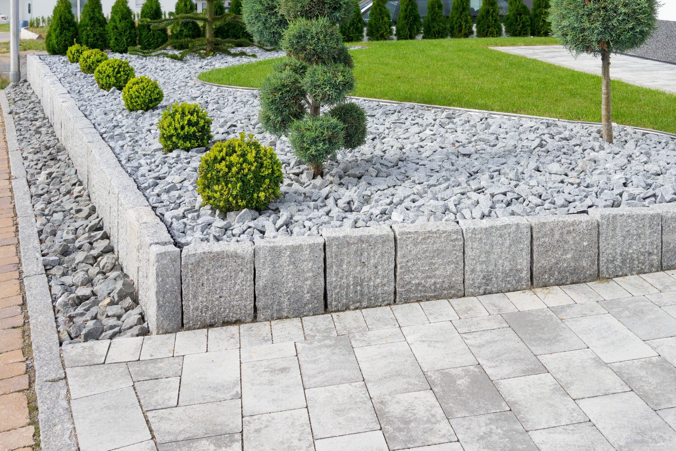 Outdoor space featuring lawn, garden, and stone pathways for a balanced design
