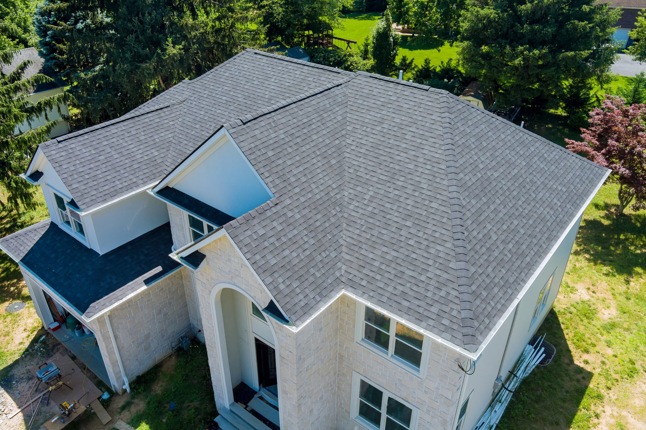 Aerial view of a home with a newly installed roof